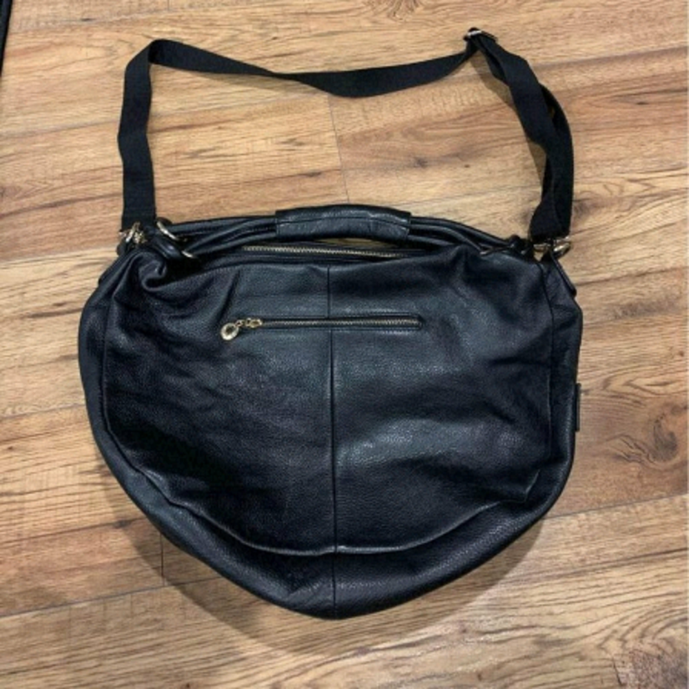 Kgb black label black leather hobo purse. 2 large zippered pockets. Cros…